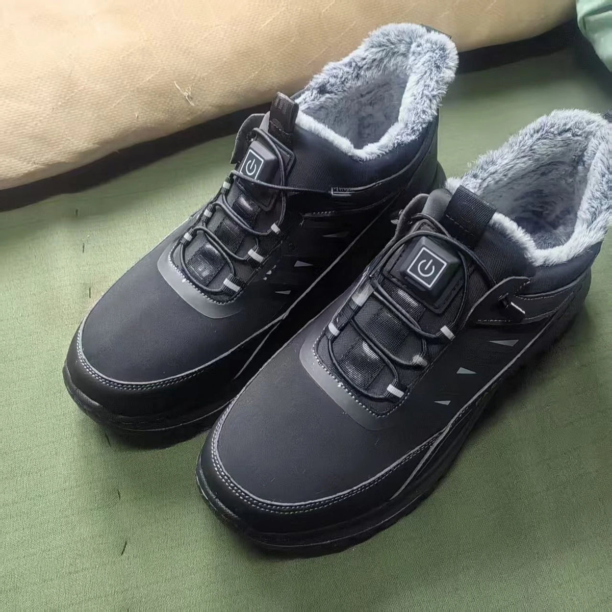 Black smart electric heated winter shoes for women with enhanced warmth and comfort, featuring sleek design and winter-ready style.