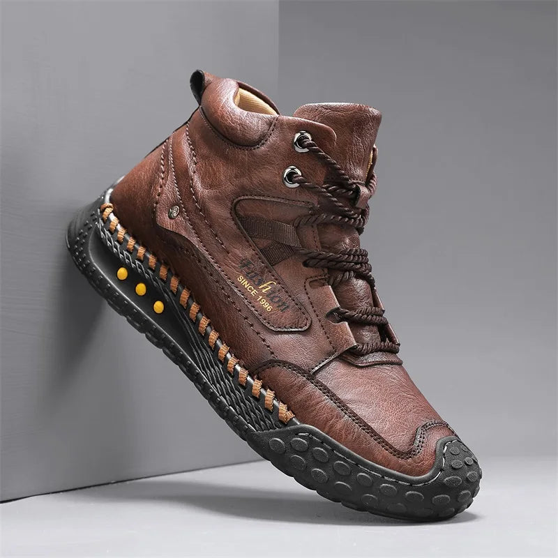 Man's handcrafted casual fashion boots in camel color by Corporación Turística, made with detailed stitching.