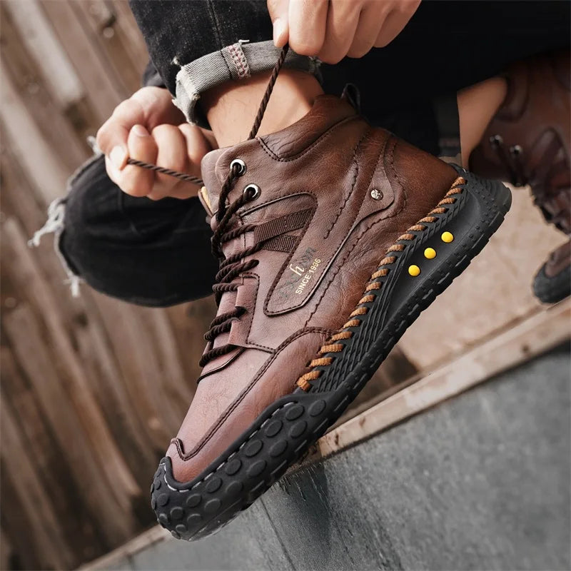 Hand-stitched men's casual fashion boots in camel color by Corporación Turística, showcasing detailed craftsmanship and style.