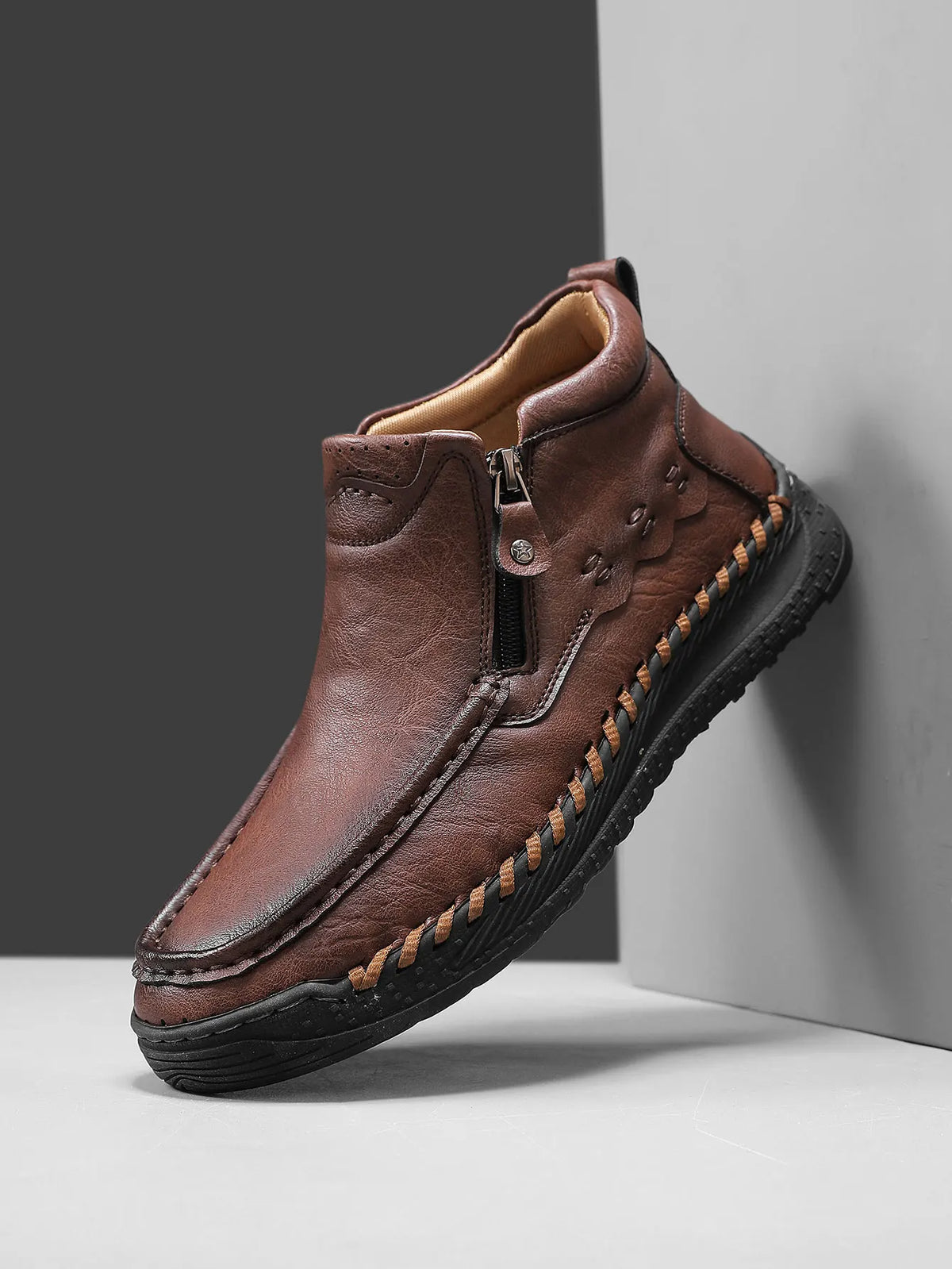 Pair of men's fashion tall boots from Corporación Turística in camel color, showing stylish design and high ankle coverage.
