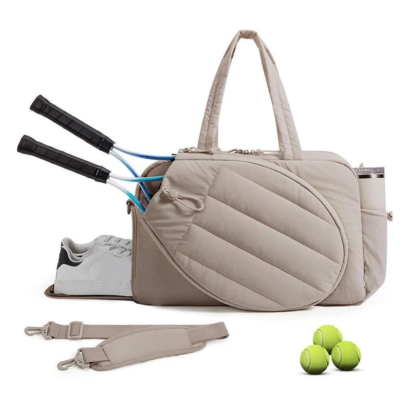 Caqui tennis racket and gym bag by Corporación Turística with multiple compartments and adjustable shoulder strap for women.