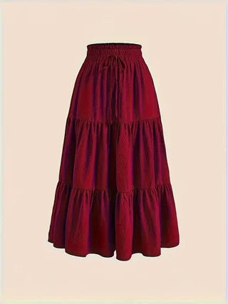 Medium-length khaki high-waist elastic skirt from Corporación Turística, displayed on a model.