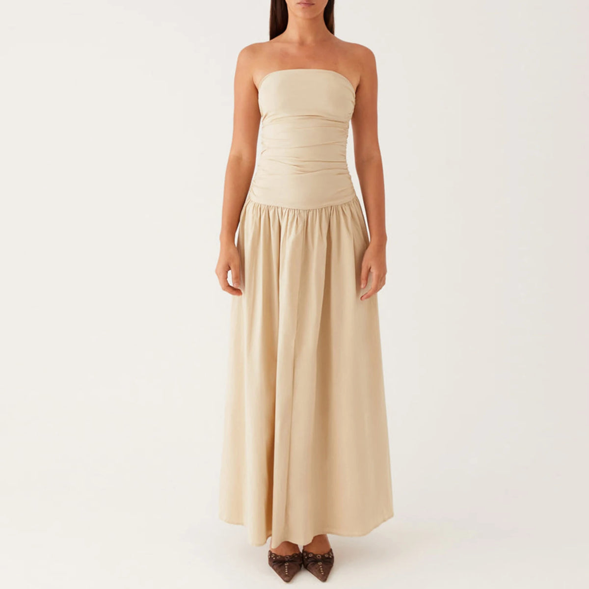 Elegant sleeveless women's long dress in caqui from Corporación Turística, showcasing a flowing, stylish design.