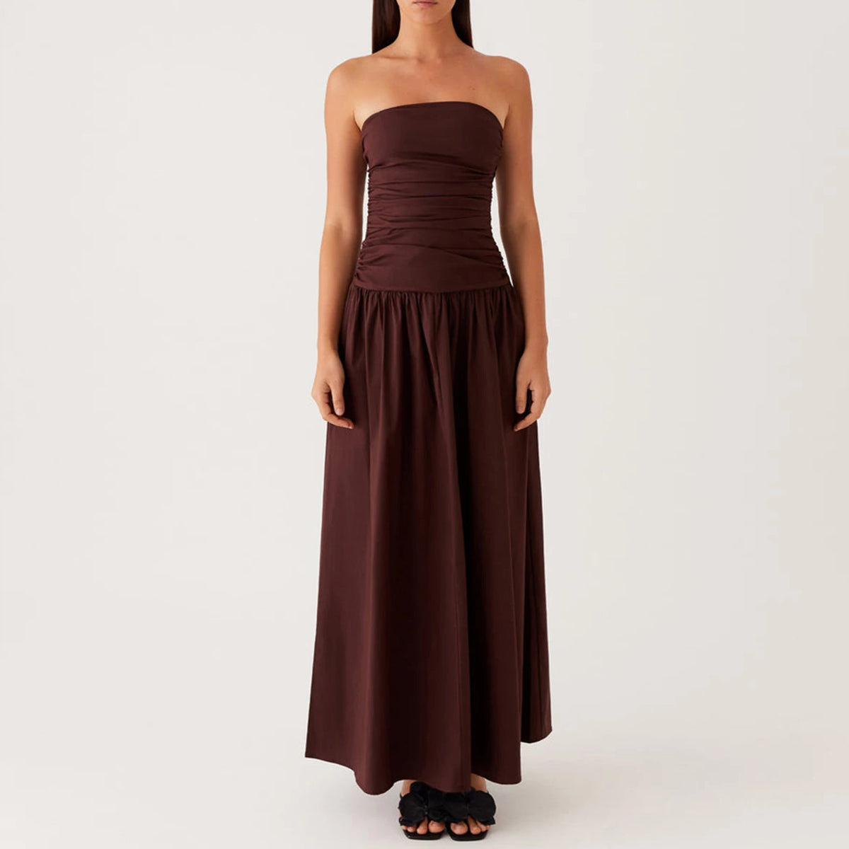 Elegant long beige strapless dress for women, stylish formal wear from Corporación Turística, perfect for special occasions.