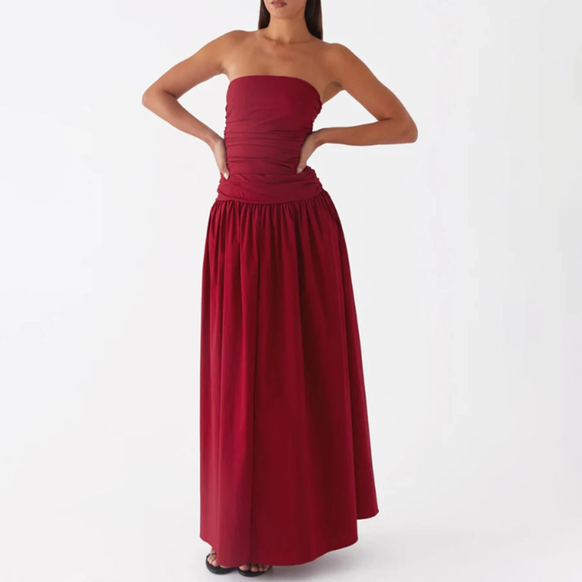 Elegant long sleeveless women's dress in caqui color by Corporación Turística, featuring a stylish V-neck design.