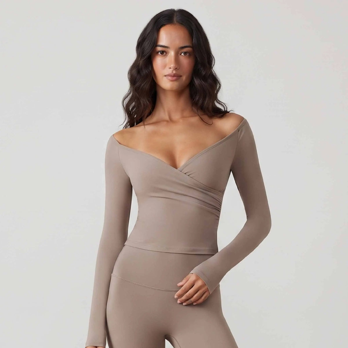 Gray women's sports camiseta with off-shoulder design and short sleeves, by Corporación Turística.