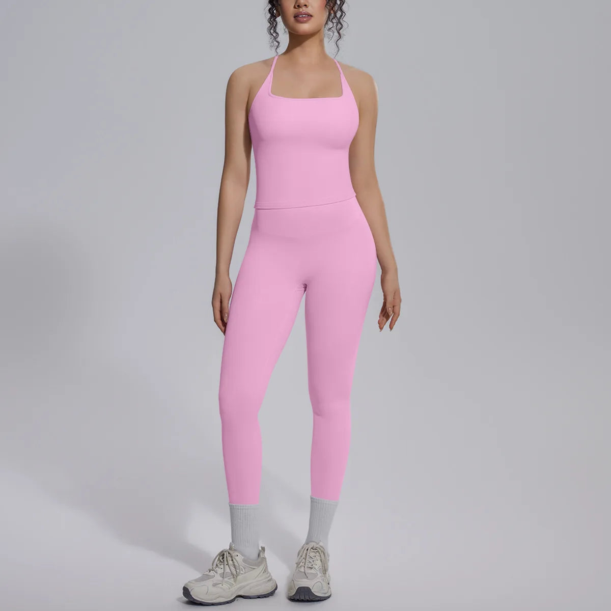 Green women's 2-piece yoga set from Corporación Turística, includes a fitted top and matching yoga pants for active wear.