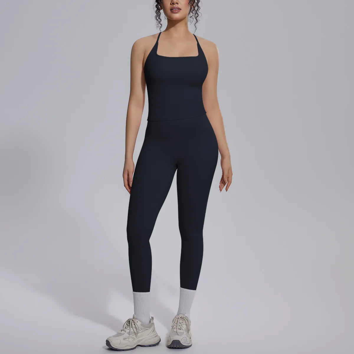 Green 2-piece women's yoga set by Corporación Turística featuring a fitted sports bra and high-waisted leggings.