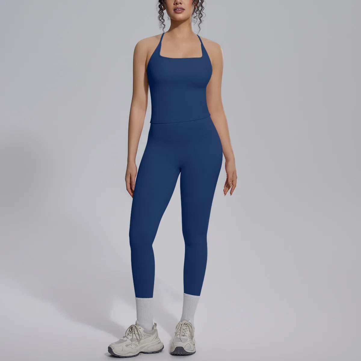Green 2-piece women's yoga set from Corporación Turística featuring a fitted top and matching leggings for exercise and activewear.
