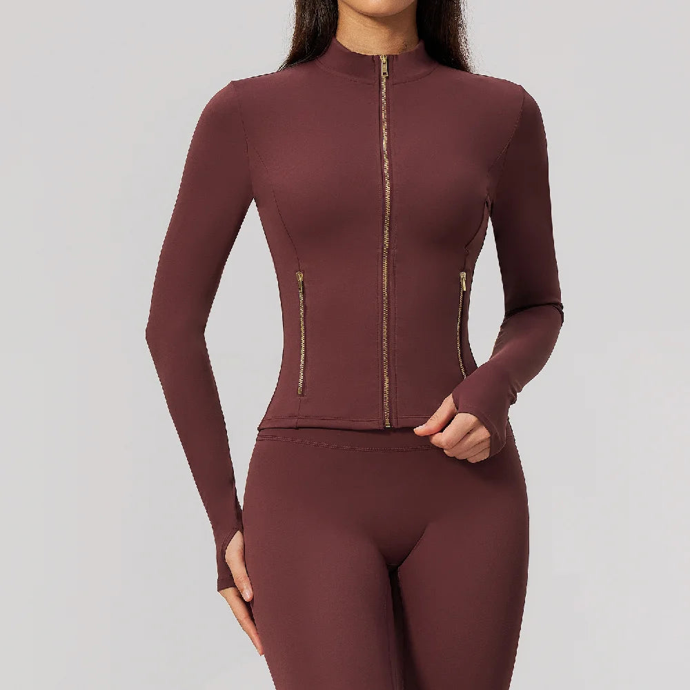 Pink long-sleeve thin sports shirt with zipper from Corporación Turística, featuring cherry blossom design and athletic fit.