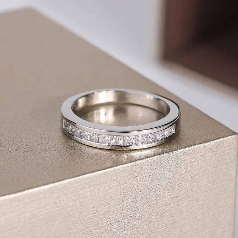 Sterling silver 925 ring with double row of cubic zirconia stones, featuring a stylish design and shiny finish.