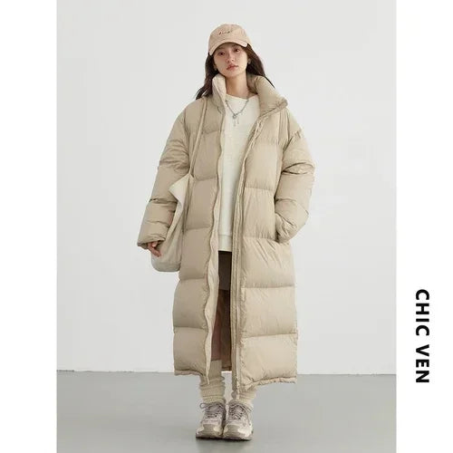 White women's duck down puffer coat from CHIC VEN by Corporación Turística, featuring a stylish design and cozy fit.