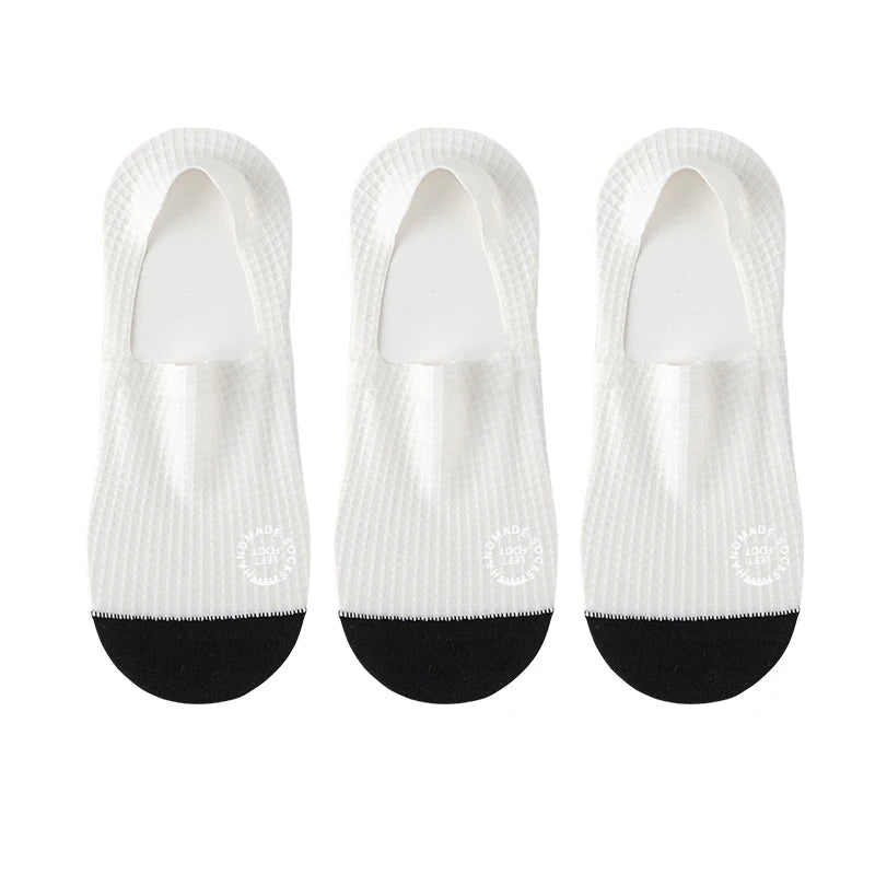 Three pairs of dark grey men's invisible socks from Corporación Turística, suitable for shoe sizes 37-44, shown laid flat.