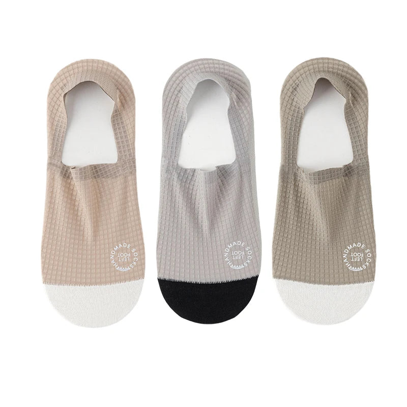 Three pairs of dark grey men's invisible socks from Corporación Turística, size EU 37-44, shown laid flat.