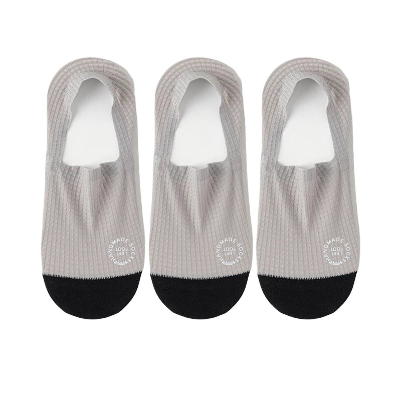 Three pairs of dark grey invisible men's socks from Corporación Turística, ideal for low-cut shoes, size EU 37-44.