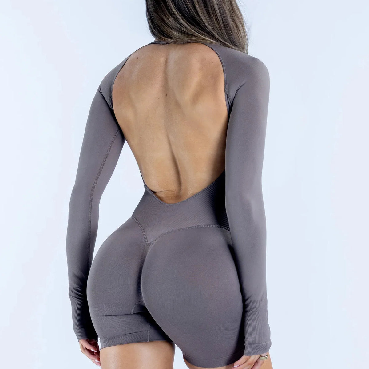Deep coffee NCLAGEN Active women's long-sleeve sports mono from Corporación Turística, designed for active wear and comfort.