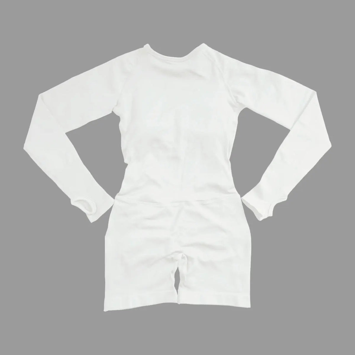 Deep coffee NCLAGEN Active long-sleeve sports jumpsuit for women by Corporación Turística, shown on a model.
