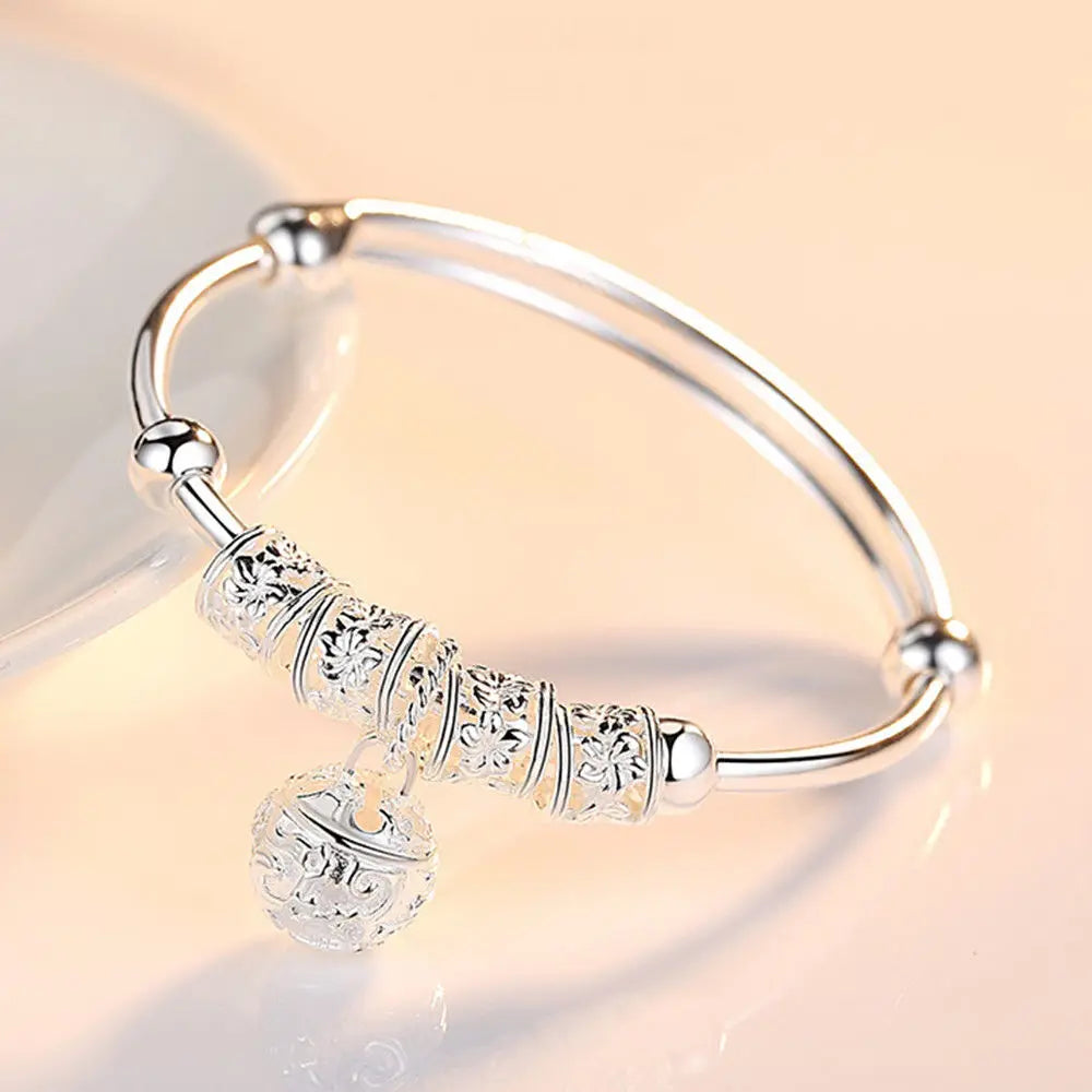 Sterling silver 925 bracelet with hollow bells, crafted by Corporación Turística, featuring intricate silver jewelry design.