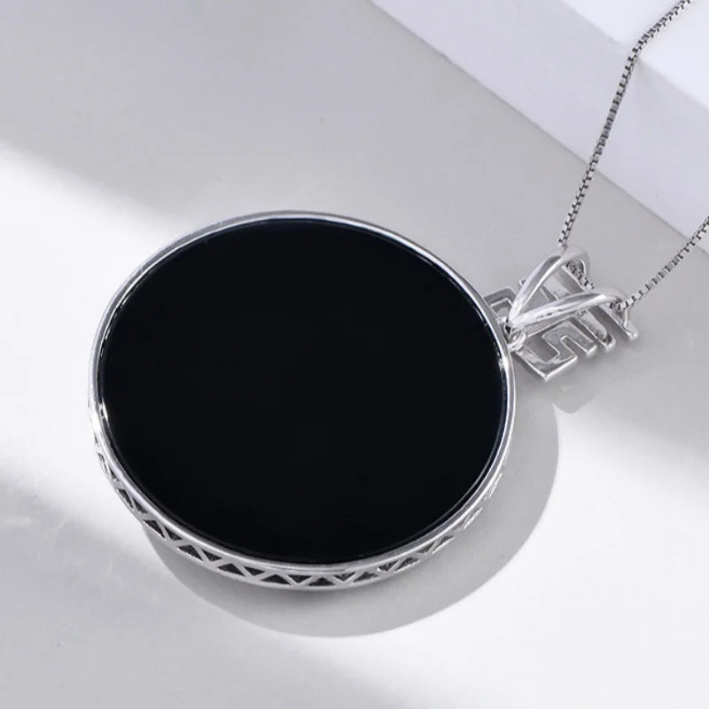 Sterling silver S925 pendant necklace for women featuring a modern design, showcasing intricate silver craftsmanship.