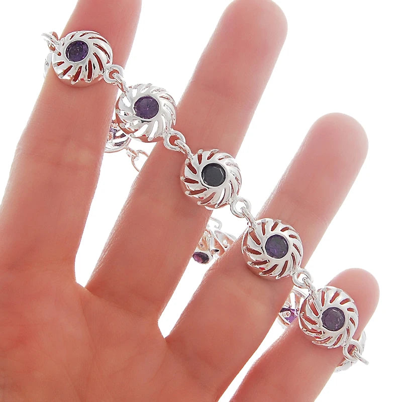 Silver infinity love bracelet for women featuring a sleek, minimalist design with a heart-shaped charm.