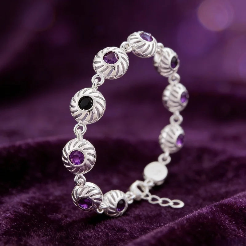 Silver infinity love bracelet for women featuring a sleek, minimalist design with a polished finish and adjustable clasp.