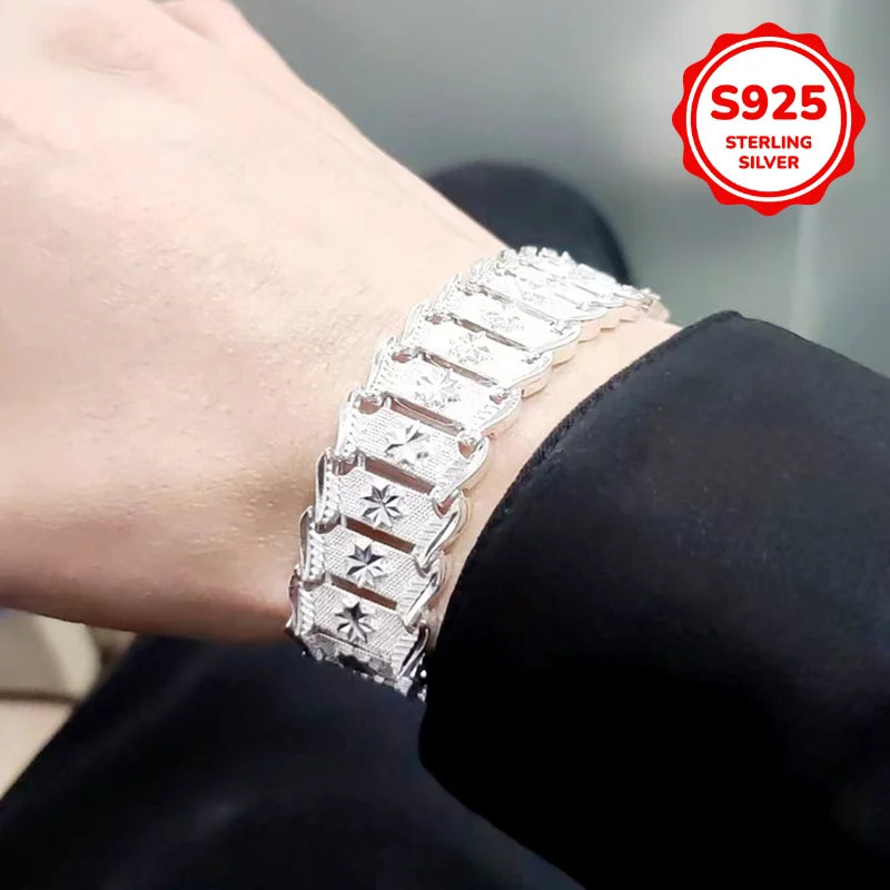 Elegant sterling silver bracelet with coin design, crafted by Corporación Turística, featuring a stylish and sophisticated accessory.