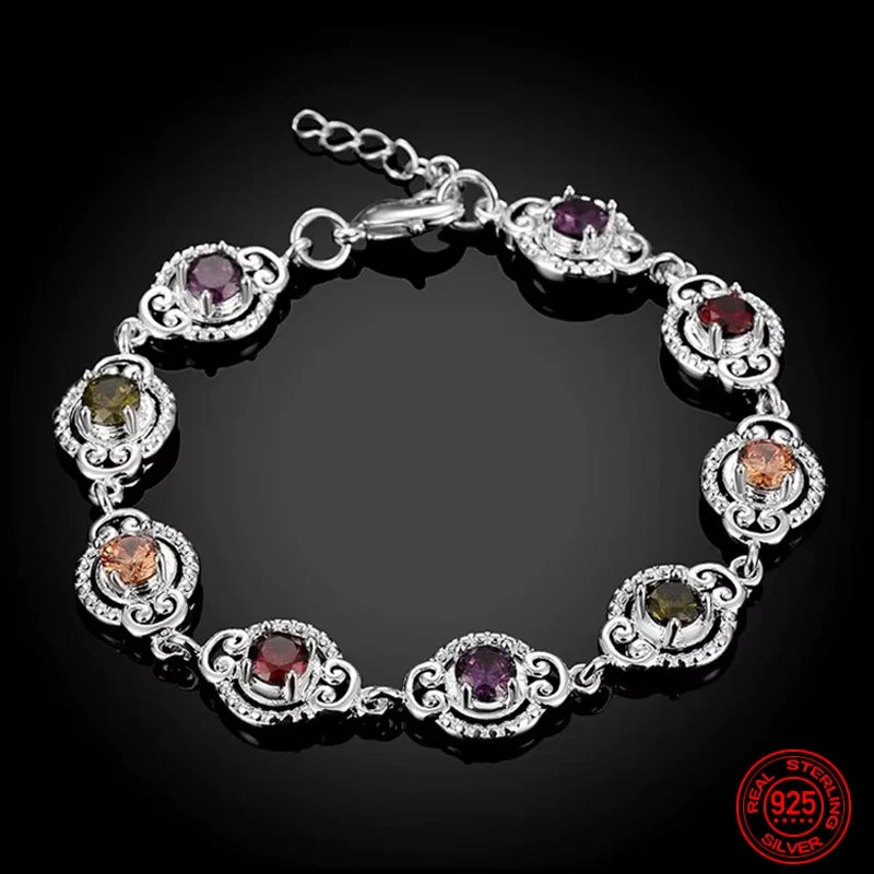 Fine sterling silver bracelet with crystal charms, featuring intricate details and elegant design from Corporación Turística.