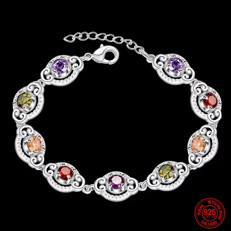 Fine sterling silver bracelet with crystal charms, featuring delicate design and intricate details. Perfect for elegant jewelry wear.