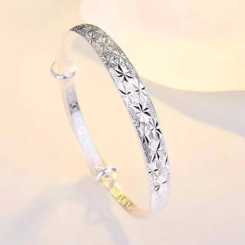 Romantic silver bracelets made of 925 sterling silver with decorative fo elements, stylish jewelry by Corporación Turística.