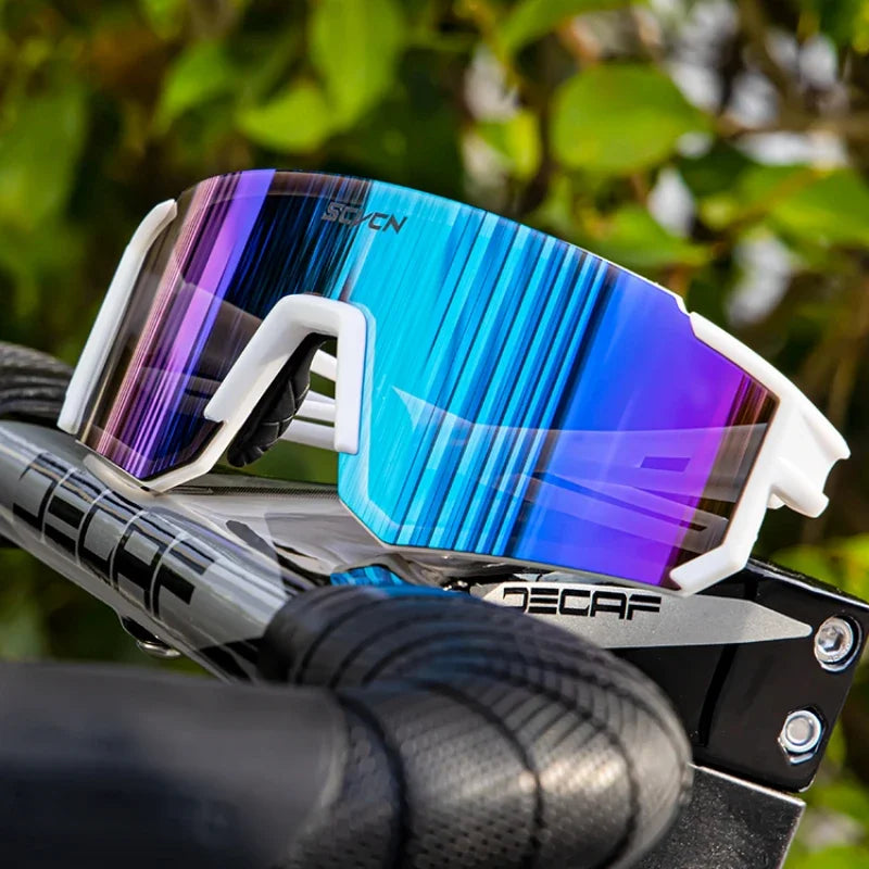 Pair of outdoor cycling sunglasses from Corporación Turística with black frame and tinted lenses, designed for active outdoor use.