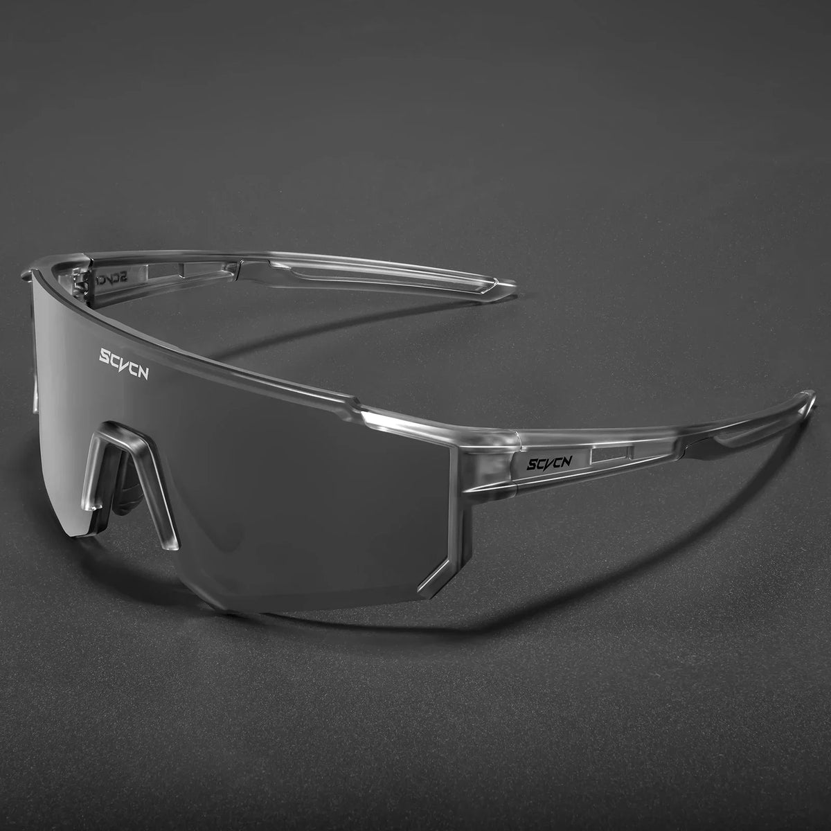 Pair of outdoor cycling sunglasses from Corporación Turística with black frames and tinted lenses for sun protection.