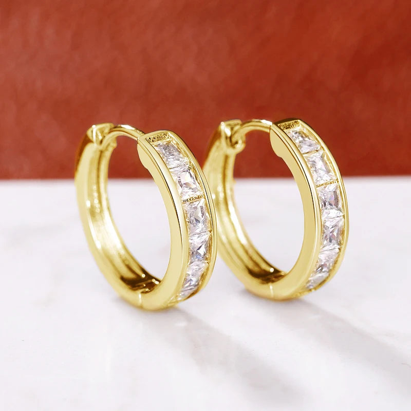 Classic hoop earrings for women by Corporación Turística, featuring a simple, elegant round design in shiny metal.