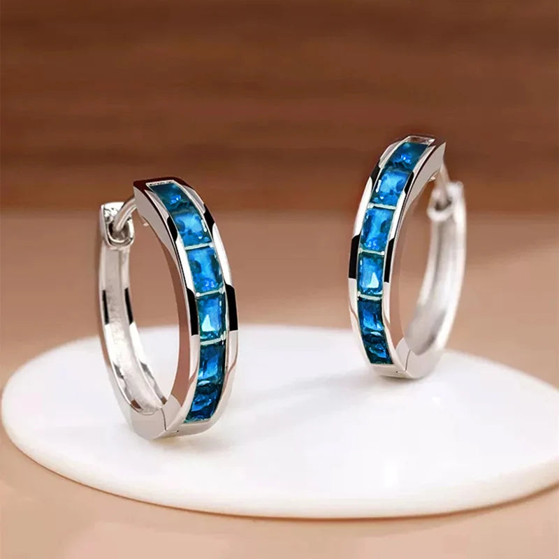 Classic hoop earrings for women by Corporación Turística, featuring a simple, elegant design with a polished finish.