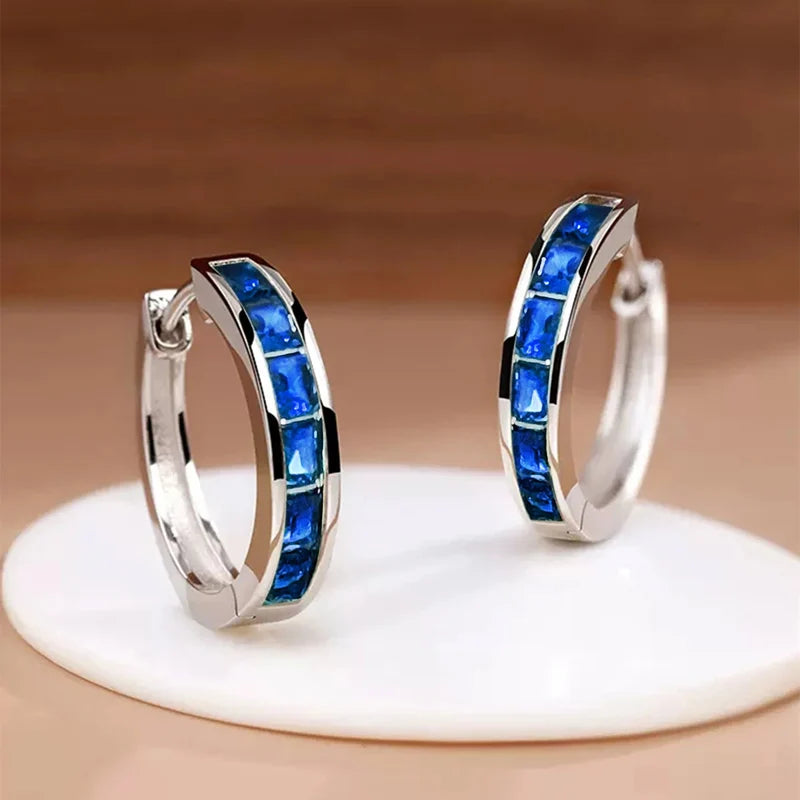 Gold hoop earrings for women featuring a classic design, crafted by Corporación Turística.
