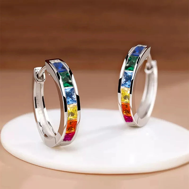 Gold hoop earrings with a classic design for women, featuring smooth, polished surfaces and a secure clasp.