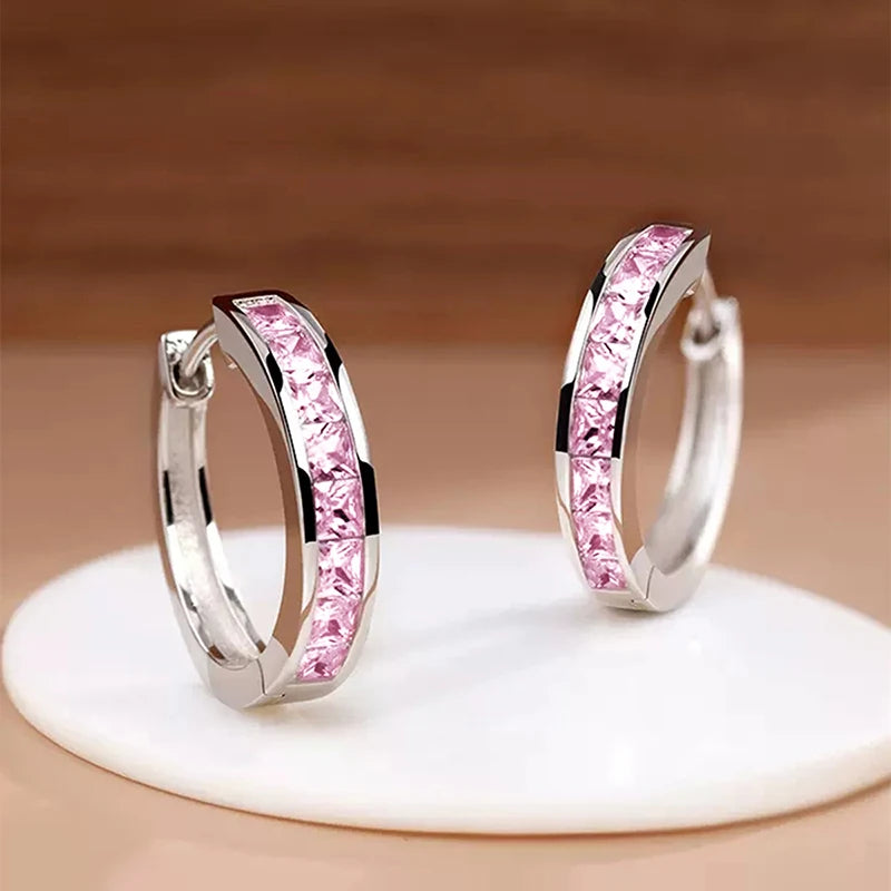 Classic hoop earrings for women by Corporación Turística, featuring a sleek circular design and polished finish.