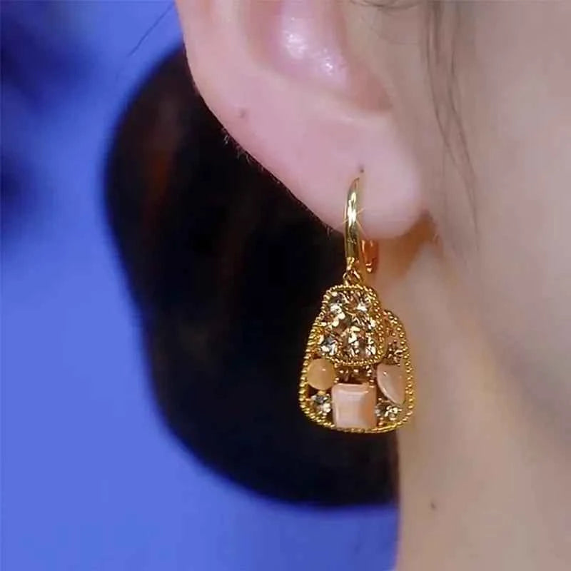 Square crystal zirconia earrings from Corporación Turística featuring brown gemstone accents and a silver-tone setting.