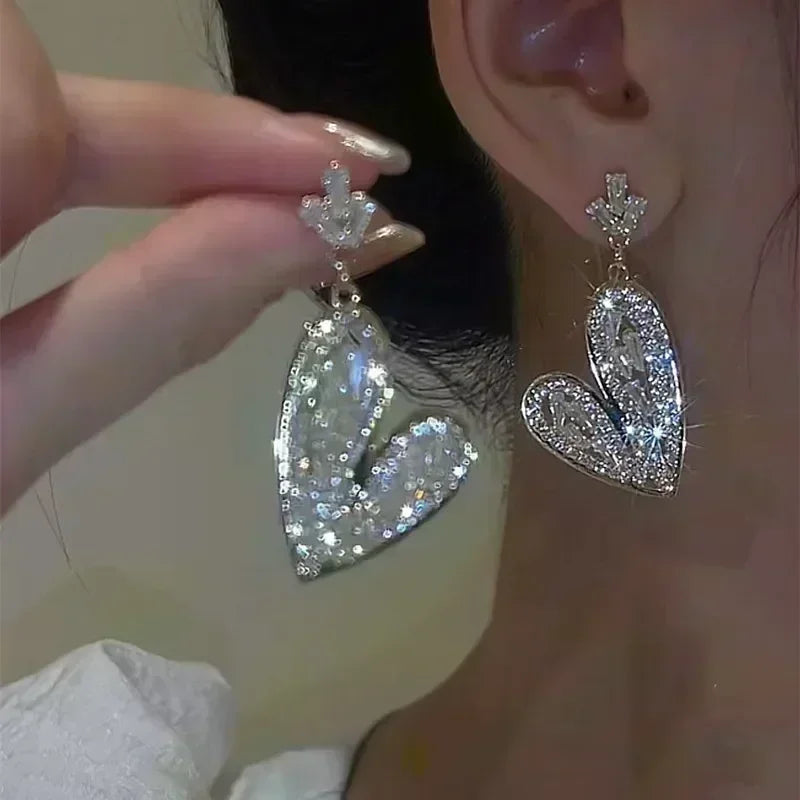 Square crystal zirconia earrings featuring brown stones, stylish jewelry by Corporación Turística, shown on a white background.