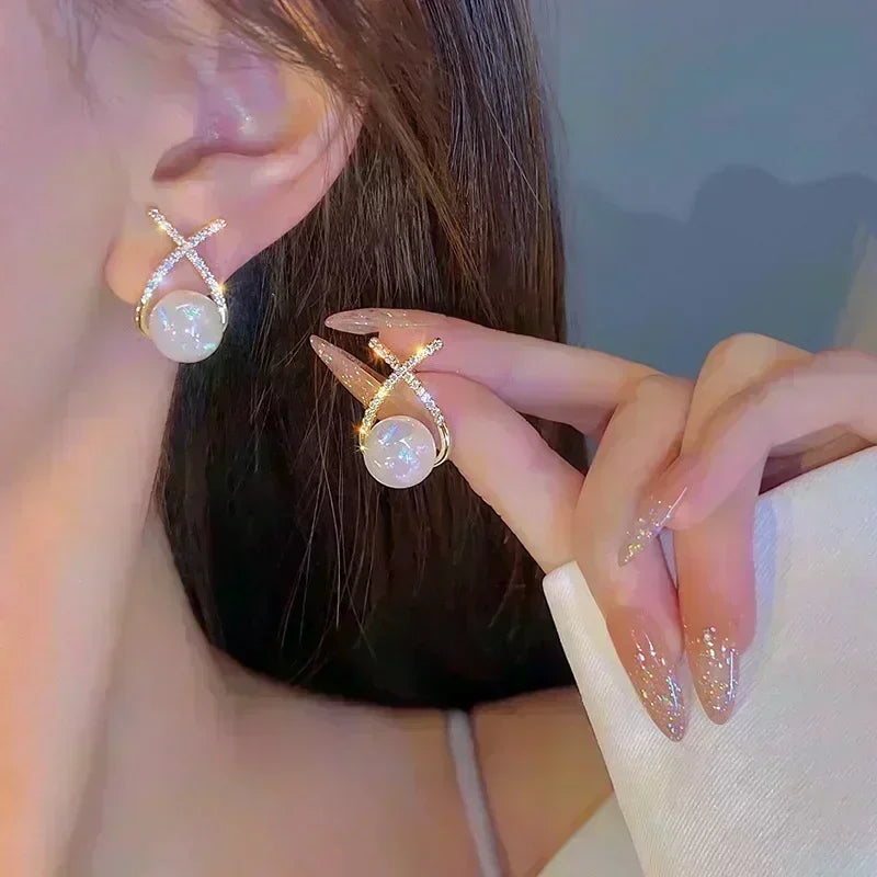 Square crystal zirconia earrings featuring brown stones, stylish jewelry by Corporación Turística, shown in close-up image.