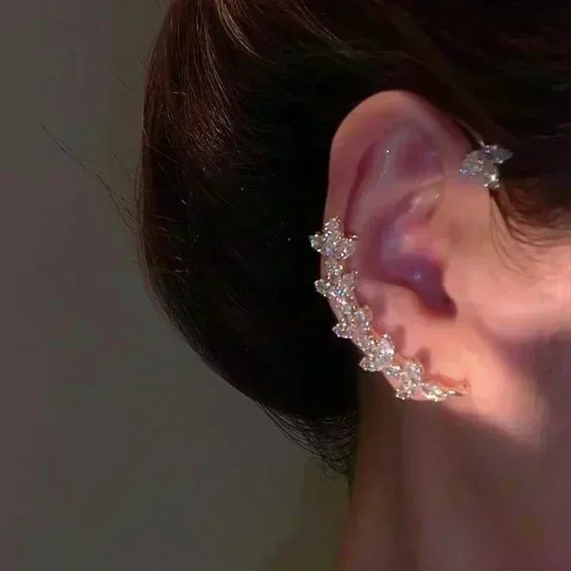 Square crystal zirconia earrings in warm brown, designed by Corporación Turística, shown on a white background.