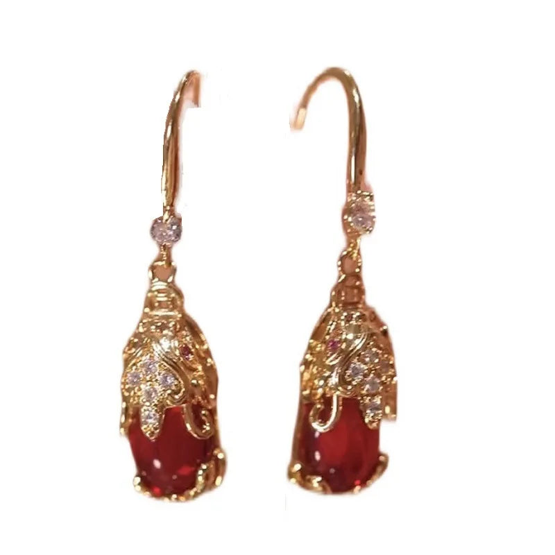 Red retro Pixiu earrings for women by Corporación Turística, featuring traditional Chinese-inspired design and vibrant color.