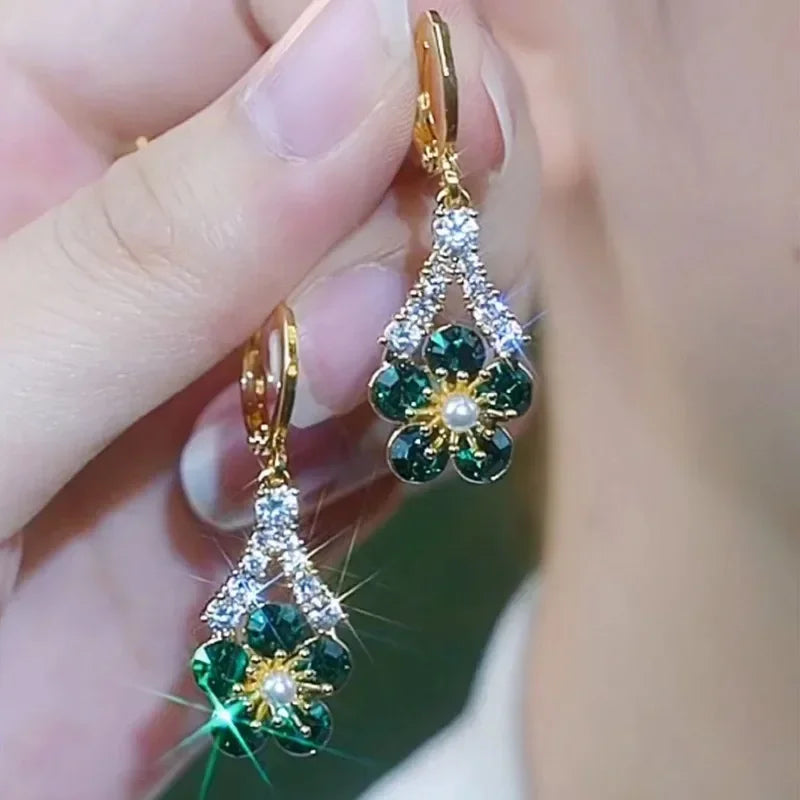 Elegant green crystal flower earrings from Corporación Turística, showcasing intricate floral design and luxurious craftsmanship.