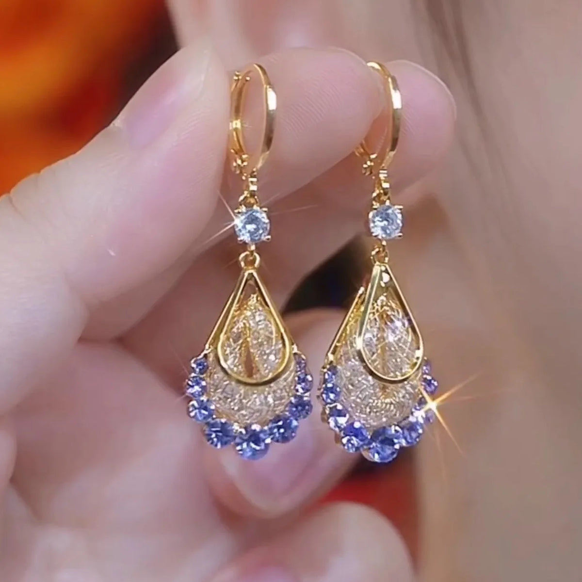 Long crystal drop tassel earrings with dangling beads, designed by Corporación Turística for elegant, stylish accessories.