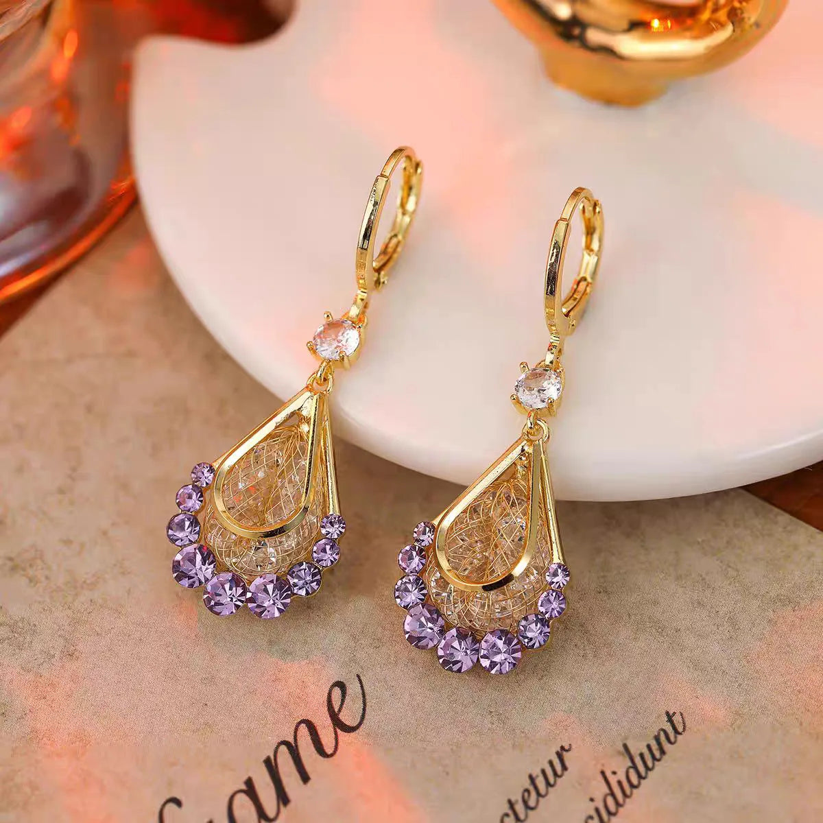Long crystal drop tassel earrings featuring hanging glass beads, stylish jewelry accessory, by Corporación Turística.