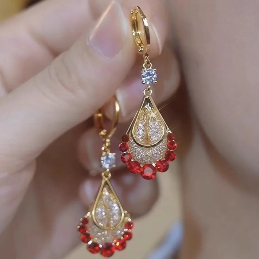 Long crystal drop tassel earrings with colorful beads, showcasing elegant jewelry design from Corporación Turística.