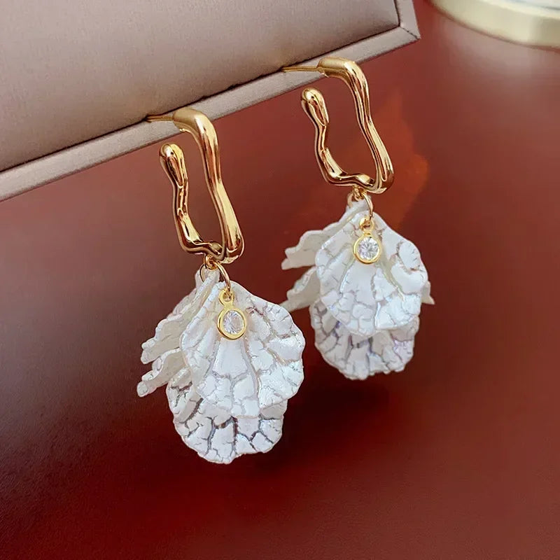 Long crystal drop tassel earrings with colorful beads, designed by Corporación Turística, featuring elegant dangling style.