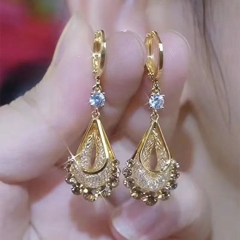 Long crystal drop tassel earrings with colorful beads, designed by Corporación Turística, featuring elegant and vibrant jewelry details.