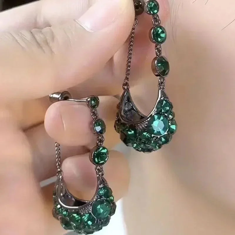 Exquisite stone eye of the tiger dangling earrings by Corporación Turística with intricate design and vibrant gemstone details.