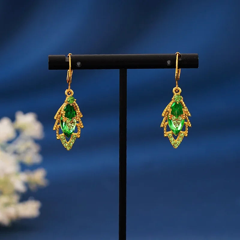 Elegant crystal drop earrings from Corporación Turística with intricate hanging design and sparkling clear crystals.