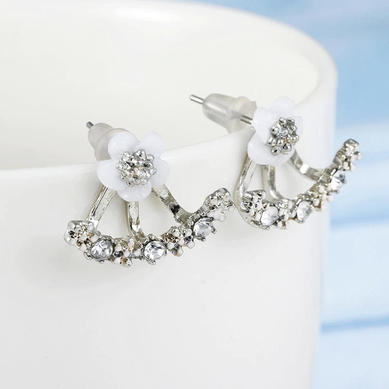 Colorful floral-themed jewelry earrings from Corporación Turística featuring delicate flower designs for a trendy look.